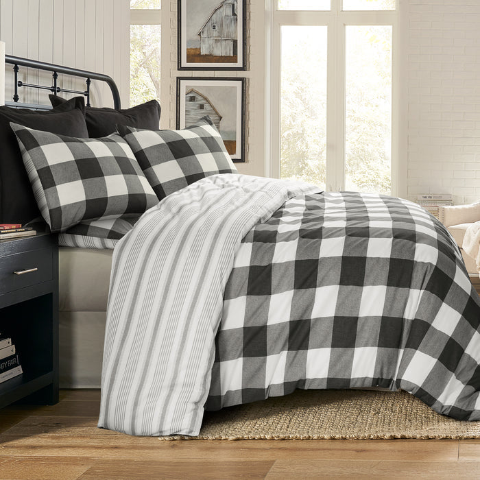 Camden Comforter Set showcasing a reversible comforter with buffalo check design and coordinating stripe on a bed in a stylish bedroom.