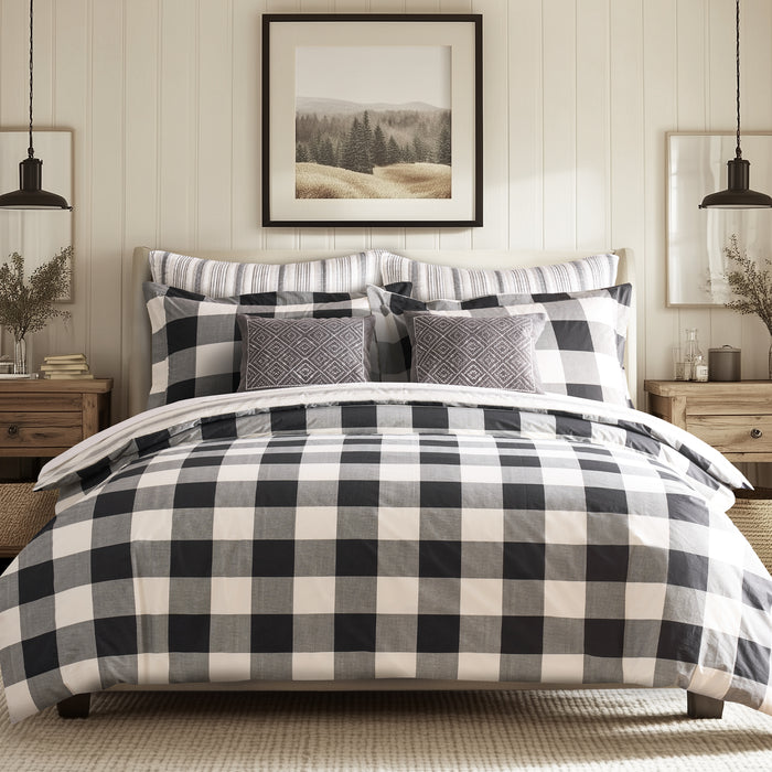 Camden Comforter Set featuring a reversible buffalo check design, soft cotton fabric, and coordinating pillows in a stylish bedroom setting.
