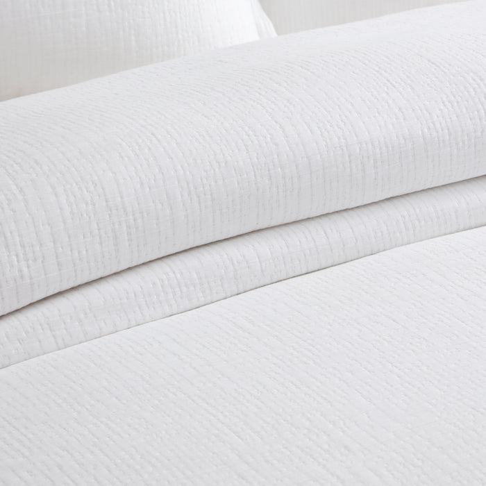 Cotton Tencel Matelasse Comforter Set with a softly textured solid design in crisp white, showcasing the comforter and pillow shams.