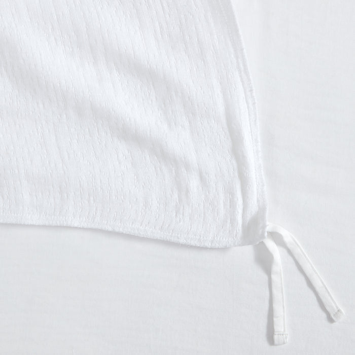 Cotton Tencel Matelasse Duvet Set showing the textured white fabric and corner ties of the duvet cover.