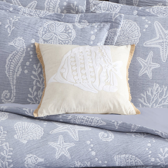 Seaside Charm Crewel Fish Pillow with shell motifs on a beach-themed bedding set.