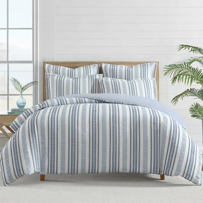 Seaside Stripes Euro Sham set of 2 featuring blue, navy and white striped cotton design on a bed.