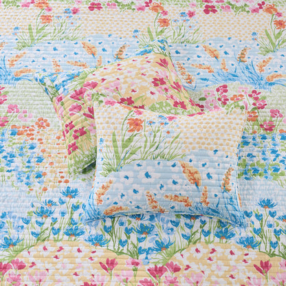 Floral quilt with matching pillow on a floral background