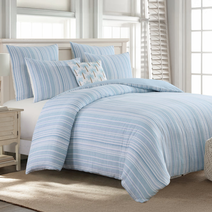 Boracay Stripe Muslin Comforter Set in soothing aqua and white tones displayed on a bed with styled pillows.