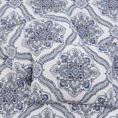 Lentana Navy Quilt Set featuring an intricate medallion pattern in navy on a soft white ground.