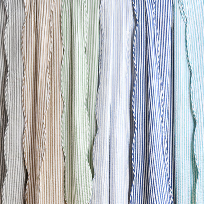 Collection of striped fabric swatches in various colors.