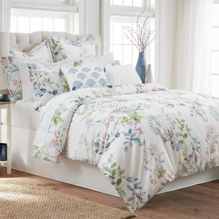 Seraphine Blooms Comforter Set displayed on a bed, featuring a floral design on smooth cotton sateen.