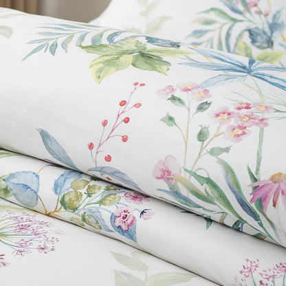Seraphine Blooms Comforter Set featuring a delicate floral design on smooth cotton fabric.