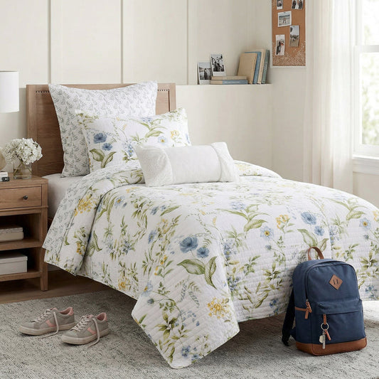 Floral bedding set on a bed with a backpack and sneakers in a bedroom setting.